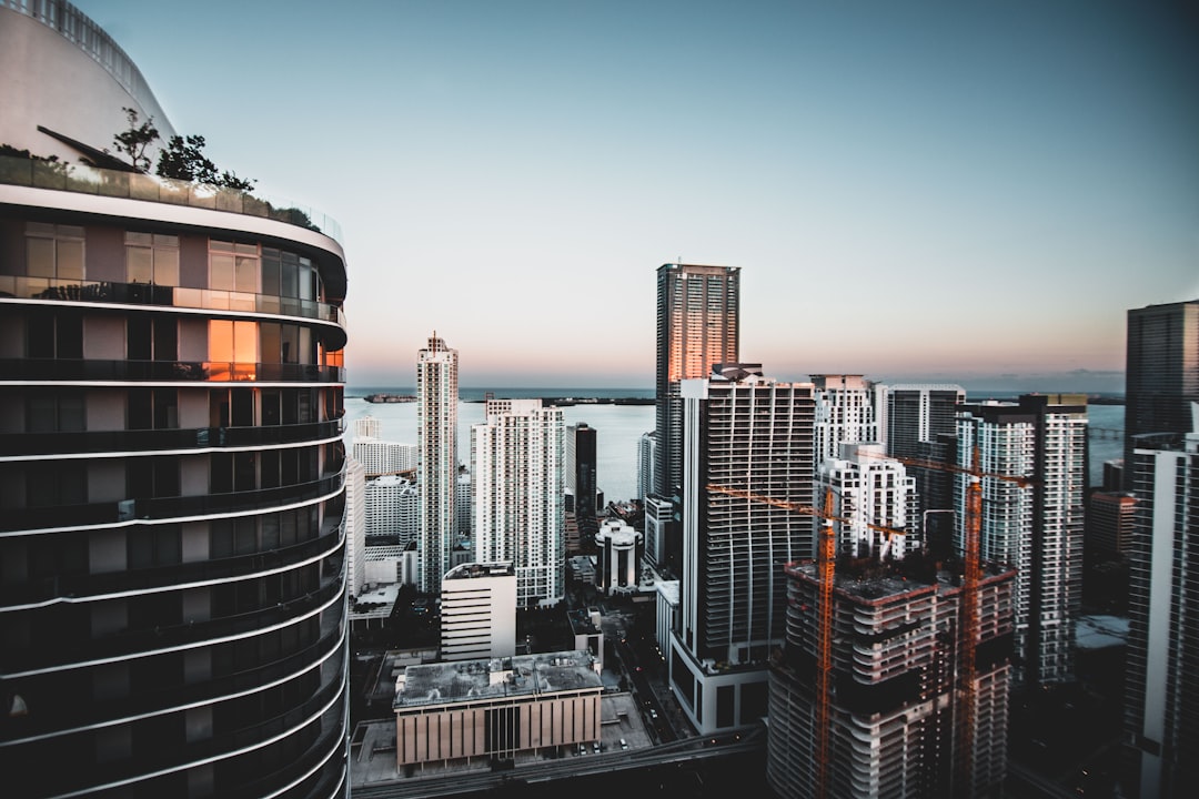 Modern high-rise buildings in a business district, suggesting enterprise scale and urban European corporate environments