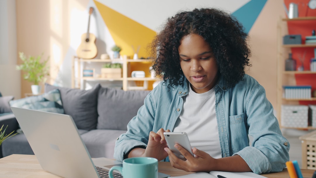 Professional working at a desk with digital tools, representing enterprise AI literacy and competence development in a modern workplace