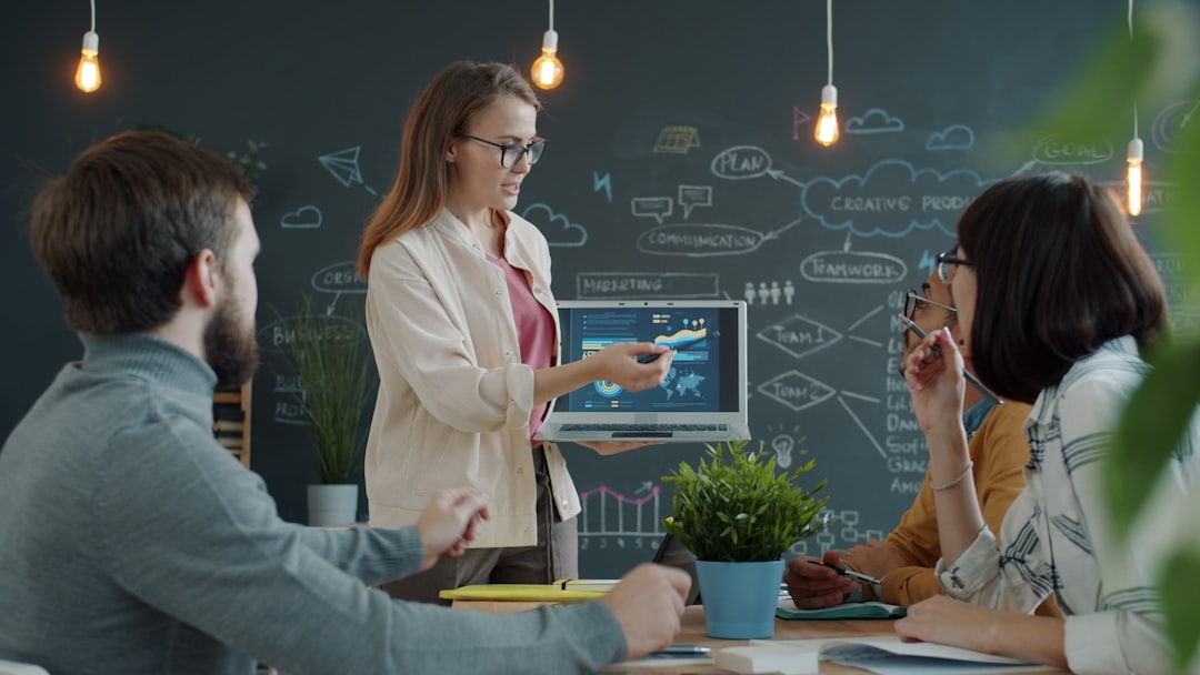 Business professional presenting a strategic framework to colleagues, representing cross-regulatory governance alignment for enterprise AI systems